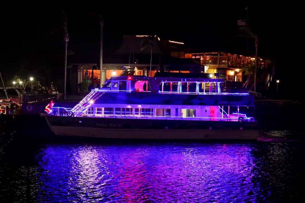 Catamaran Hoku Nai'a celebrates the holidays in the Dana Point Harbor Boat Parade of Lights. Perfect boat for a holiday party!