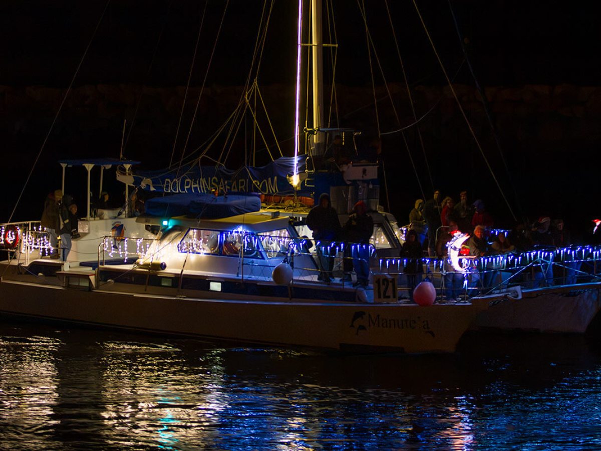 Catamaran Manute'a celebrates the holidays in the Dana Point Harbor Boat Parade of Lights
