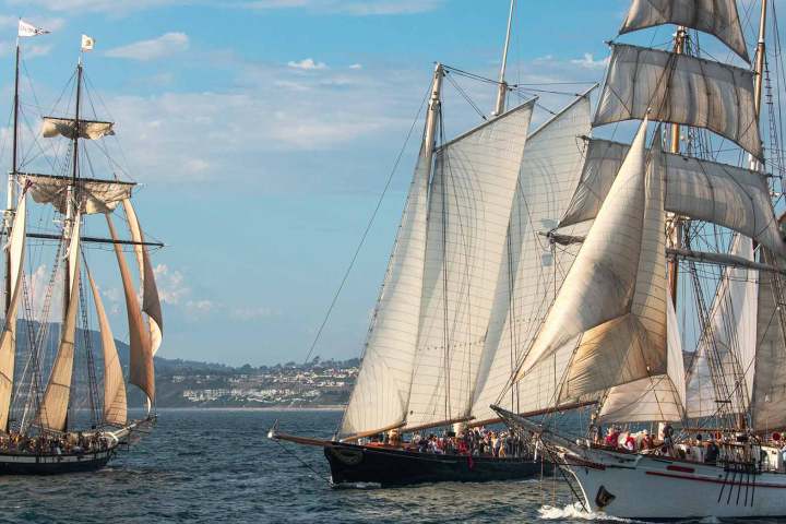 Tall Ships participate in mock cannon battle during Dana Point Tall Ships Festival