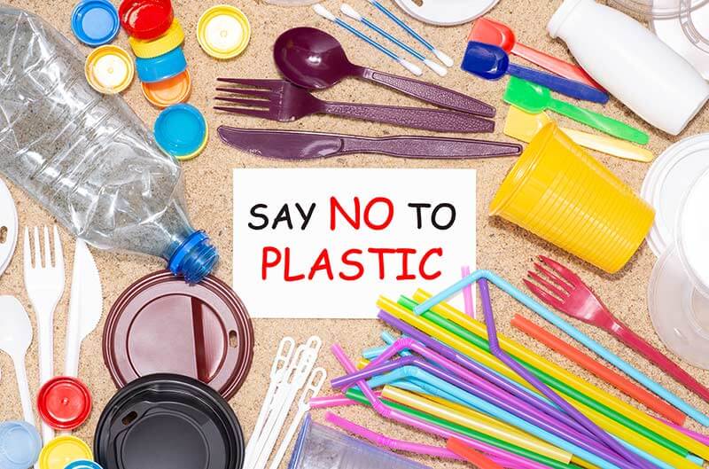 Single-use plastics on sand