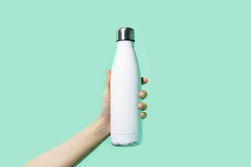 Reusable Water Bottle Hand holding white reusable bottle