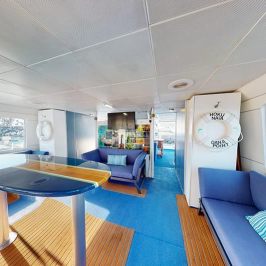Sofas and surfboard table on main deck of Hoku Nai'a Whale Watching Power Catamaran off the coast of Dana Point, CA