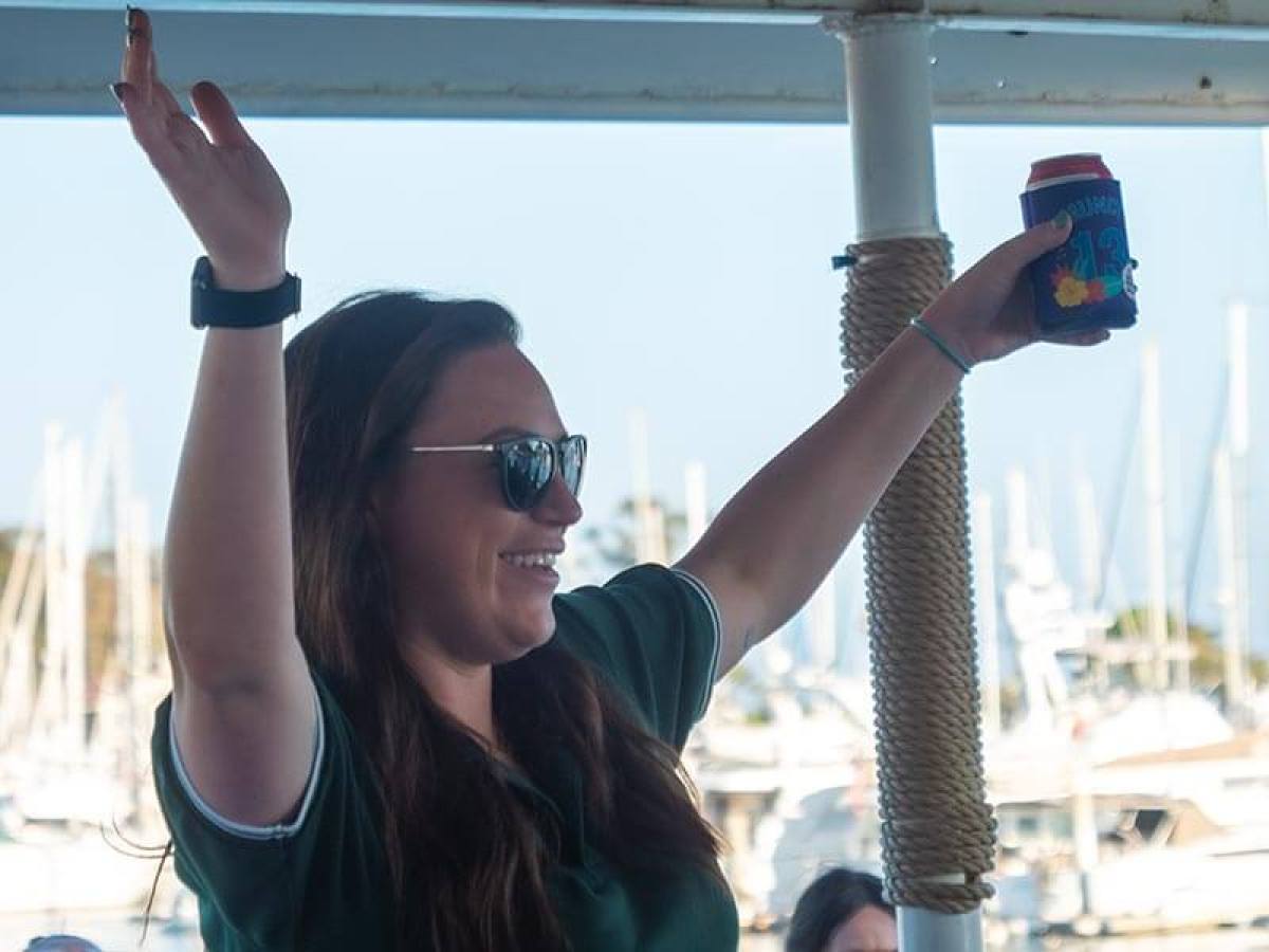 A woman having fun during Brews Cruise beer tasting experience in Dana Point