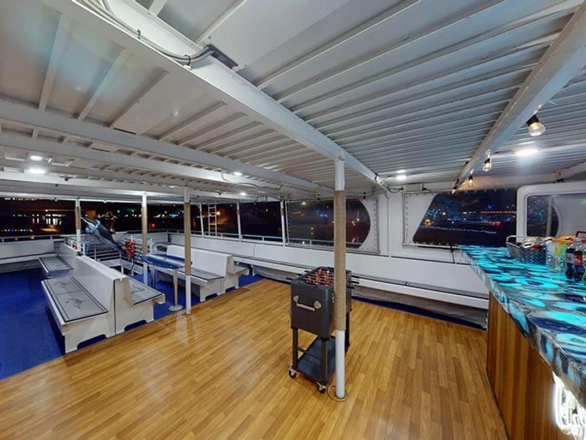 Bar and wood dance floor on observation deck of Hoku Nai'a Whale Watching Power Catamaran off the coast of Dana Point, CA