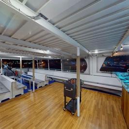 Bar and wood dance floor on observation deck of Hoku Nai'a Whale Watching Power Catamaran off the coast of Dana Point, CA