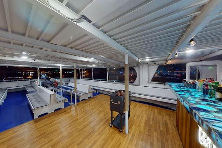 Bar and wood dance floor on observation deck of Hoku Nai'a Whale Watching Power Catamaran off the coast of Dana Point, CA