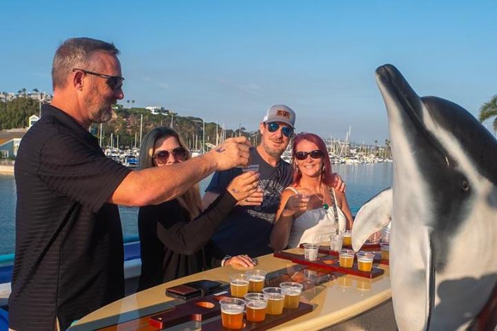 A toast among friends during a beer tasting party boat cruise