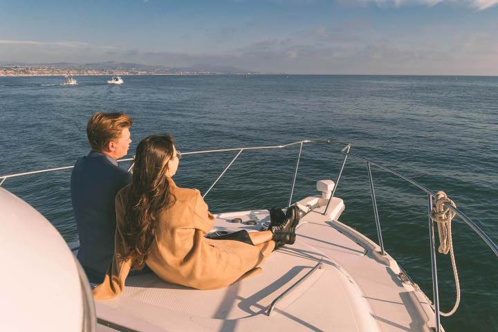 Marriage proposal during sunset on a yacht off the coast of Dana Point, California