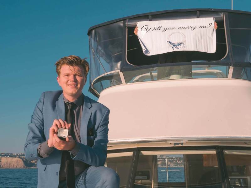 Marriage Proposal Marriage proposal during sunset with a custom banner on a yacht off the coast of Dana Point, California