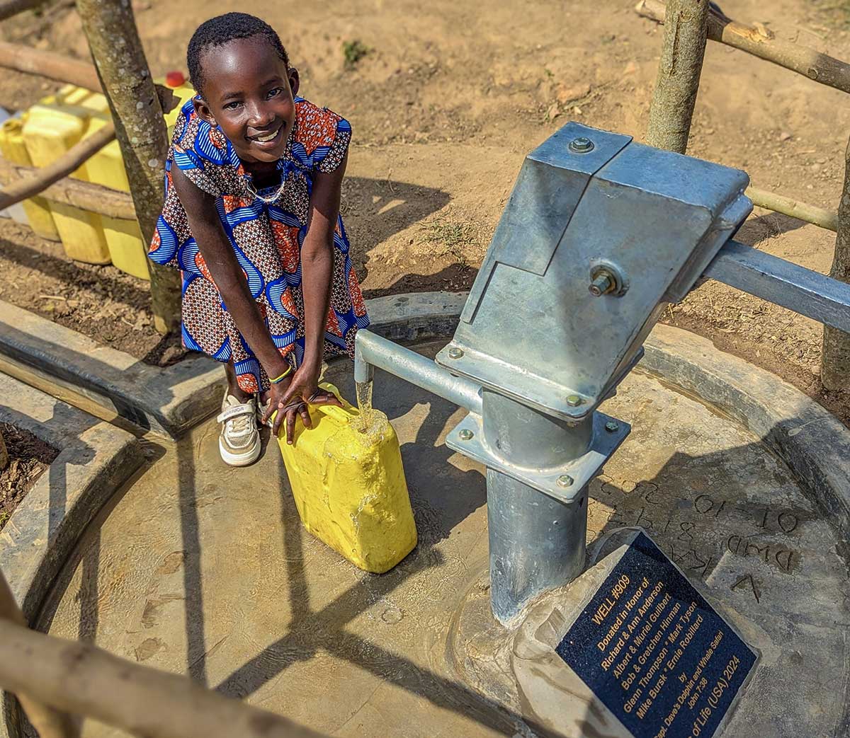 Wells-of-Life_child-at-well_1200x1043 A child in Uganda pumps water from the well donated by Captain Dave's through Wells of Life