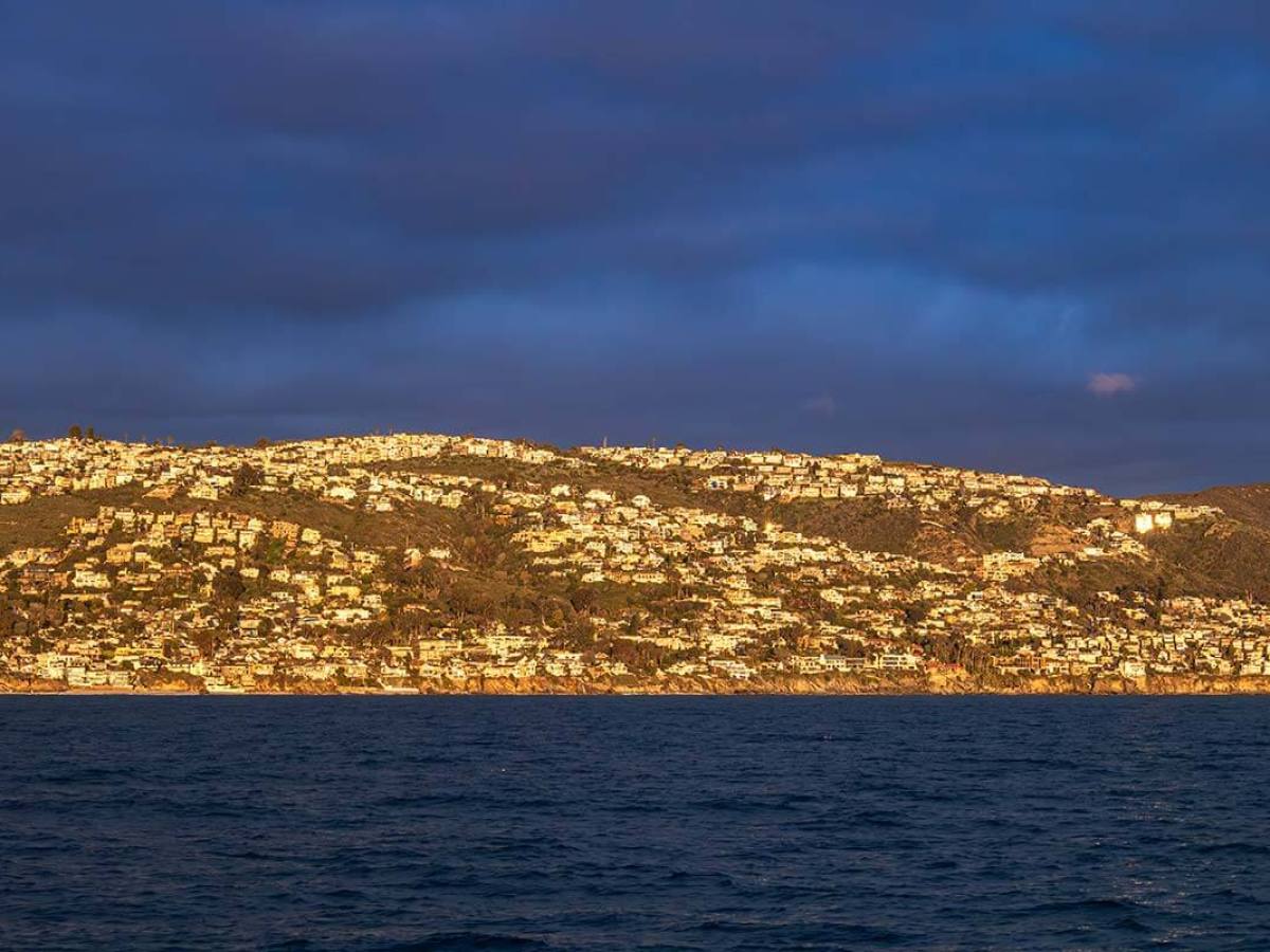 A golden sunset lights up the coastline of Orange County, near Dana Point, known as the California Riviera